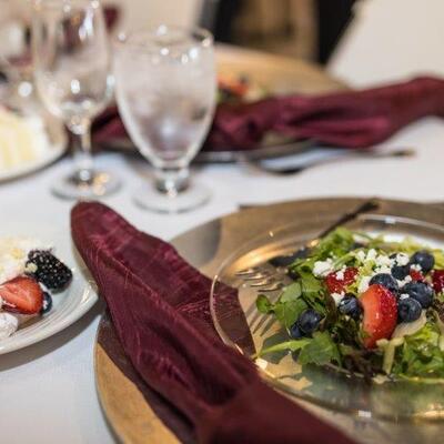 table setting with salad and dessert